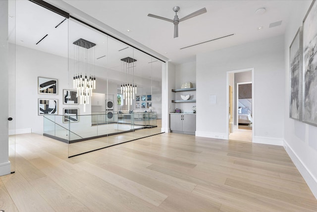 interior space with light hardwood / wood-style floors and ceiling fan