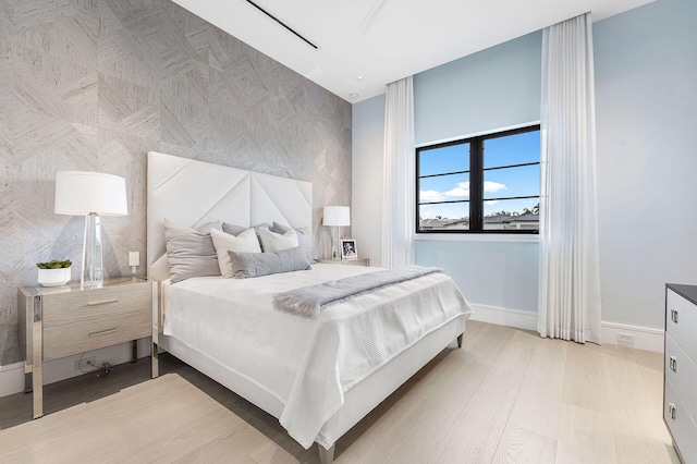 bedroom with light wood-type flooring