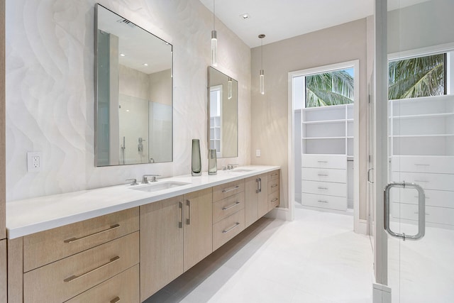 bathroom with vanity and an enclosed shower