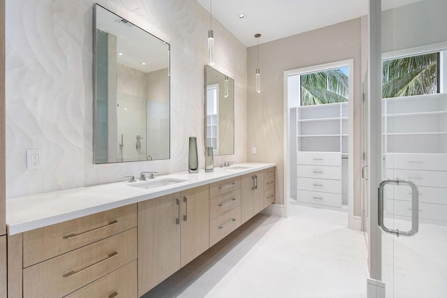 bathroom with walk in shower and vanity