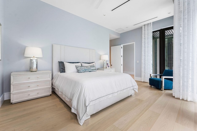 bedroom with light hardwood / wood-style flooring