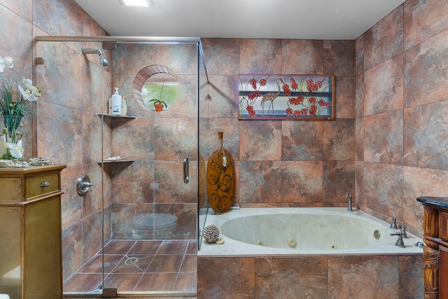 bathroom featuring vanity, separate shower and tub, and tile walls