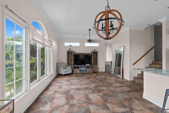 unfurnished living room with ornamental molding and a notable chandelier