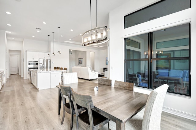 dining area featuring light wood-type flooring