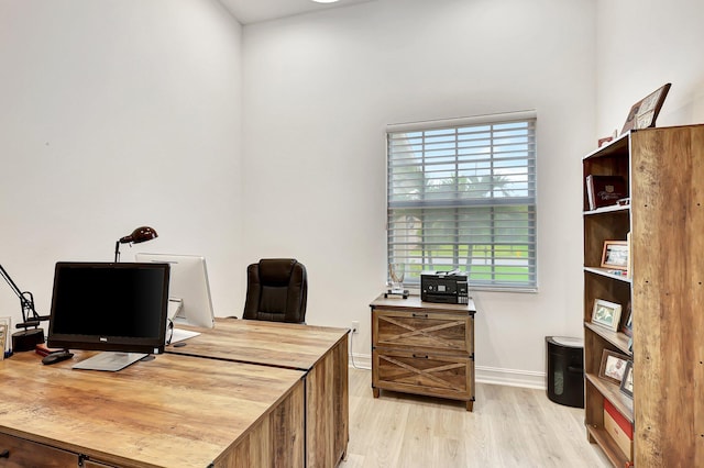 home office with light wood-type flooring