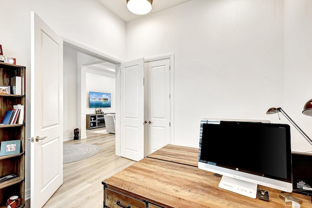 office area with light hardwood / wood-style flooring