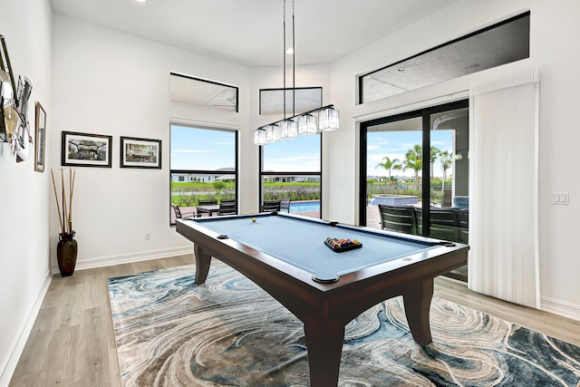 game room with billiards and light hardwood / wood-style floors