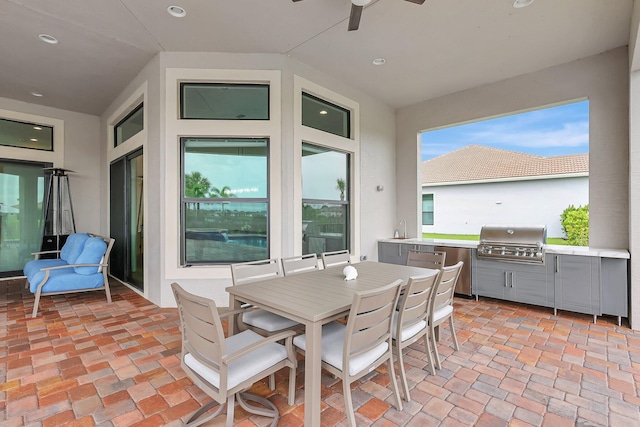 view of patio / terrace featuring ceiling fan, grilling area, sink, and area for grilling