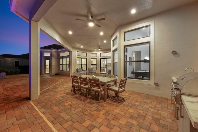 view of patio with grilling area, area for grilling, sink, and ceiling fan