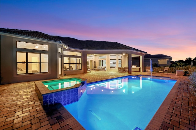 view of patio / terrace featuring a grill, an outdoor kitchen, and ceiling fan