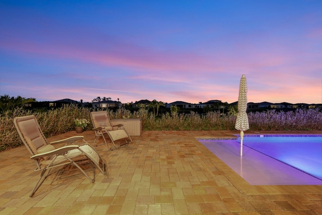 view of patio terrace at dusk