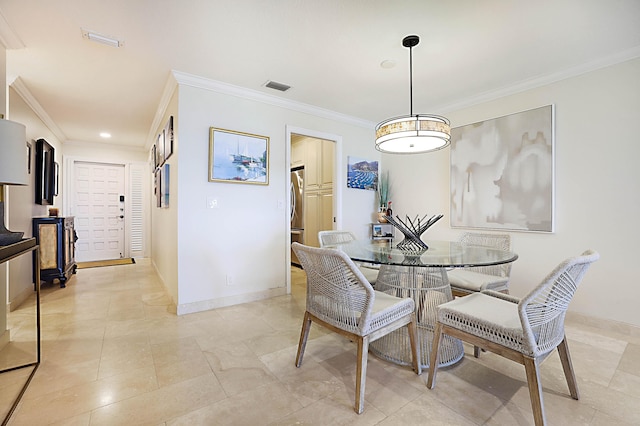 dining area with crown molding