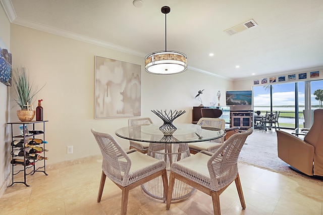 dining room with crown molding