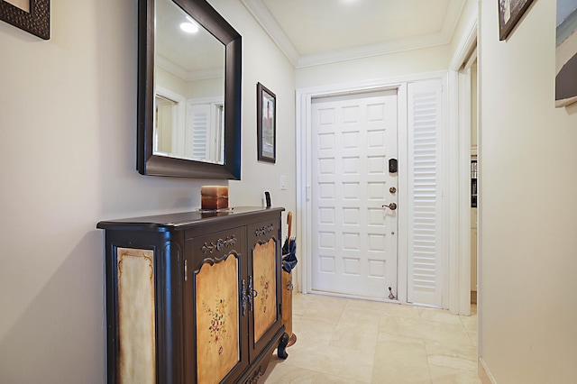 foyer entrance featuring crown molding