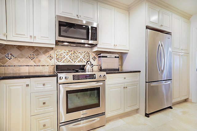 kitchen featuring dark stone countertops, tasteful backsplash, and stainless steel appliances