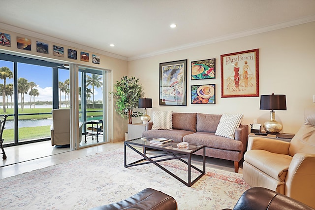 tiled living room with a water view and ornamental molding