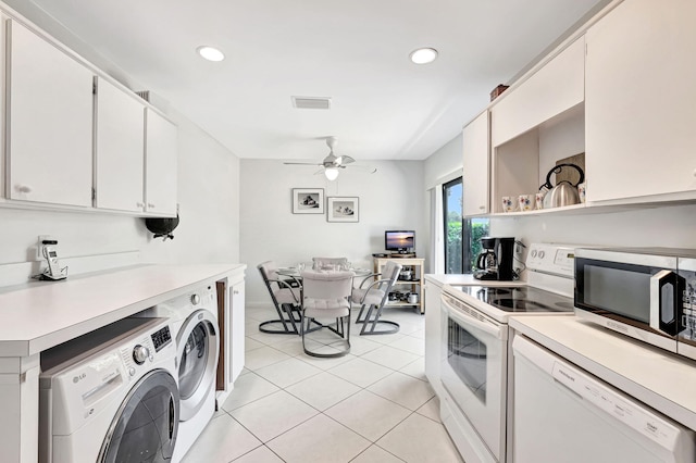 kitchen featuring white appliances, light tile patterned floors, ceiling fan, white cabinetry, and separate washer and dryer