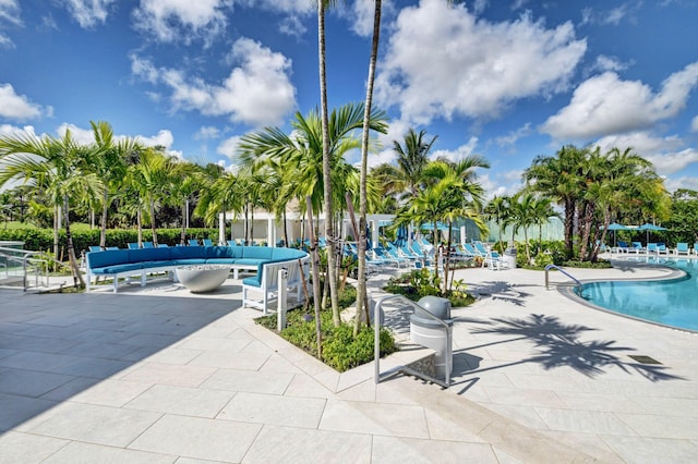 view of pool with an outdoor living space and a patio area