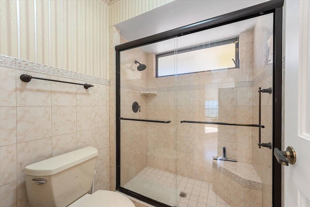 bathroom with toilet and walk in shower