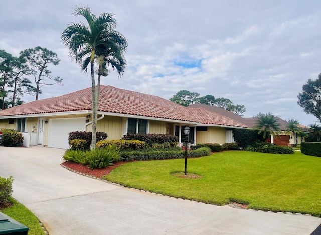 ranch-style house with a front yard and a garage