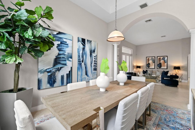 tiled dining room with decorative columns