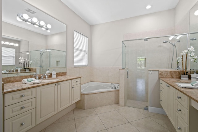 bathroom with vanity, plus walk in shower, and tile patterned flooring