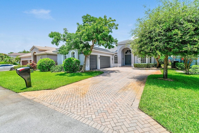 obstructed view of property with a garage and a front yard