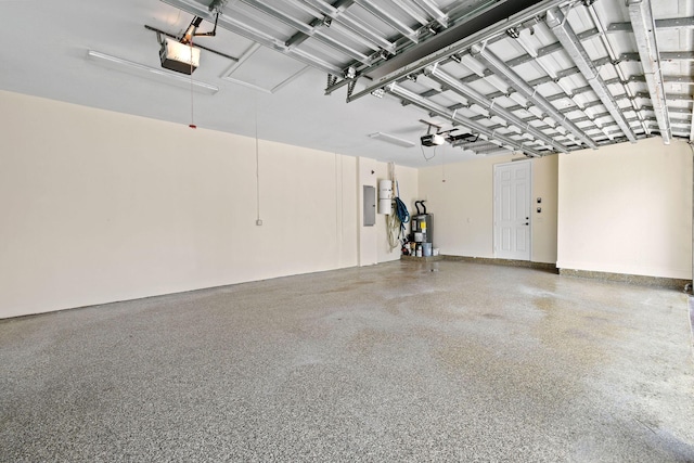 garage featuring a garage door opener, electric panel, and water heater