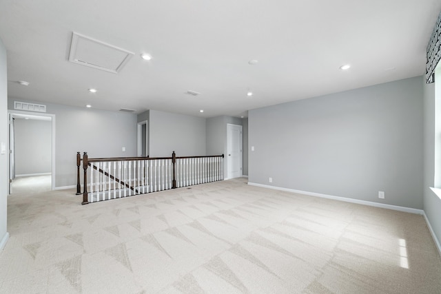 unfurnished room with light carpet