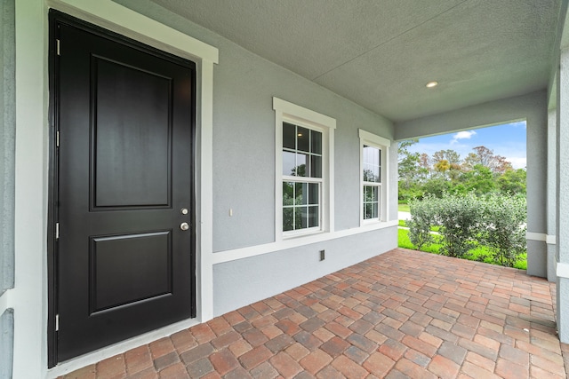 entrance to property with covered porch