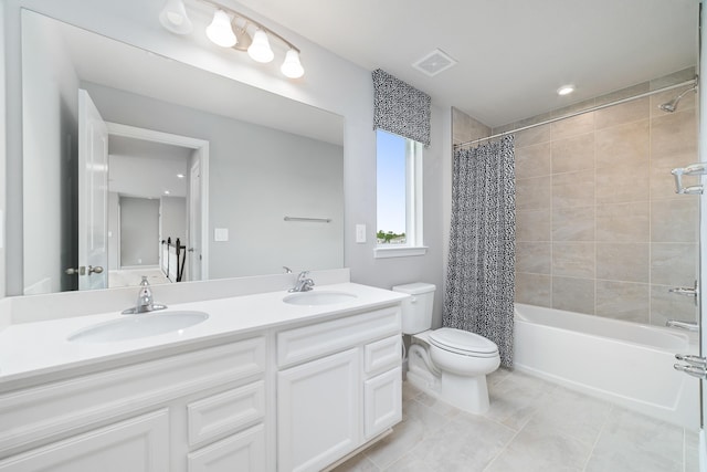 full bathroom featuring tile patterned flooring, vanity, toilet, and shower / bathtub combination with curtain