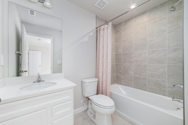 full bathroom featuring tile patterned flooring, vanity, toilet, and shower / bath combo with shower curtain