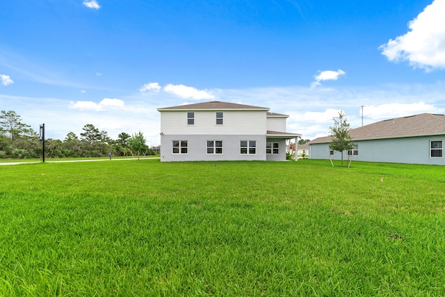 back of house with a yard