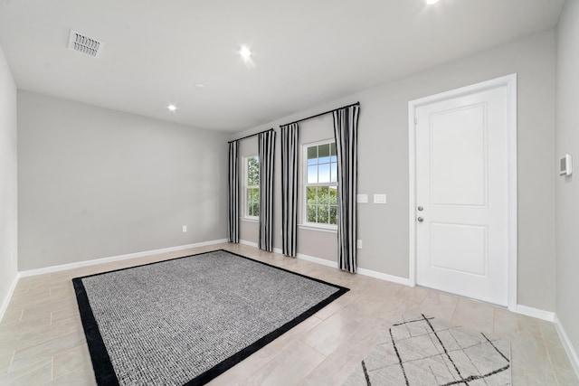 doorway to outside featuring light tile patterned floors