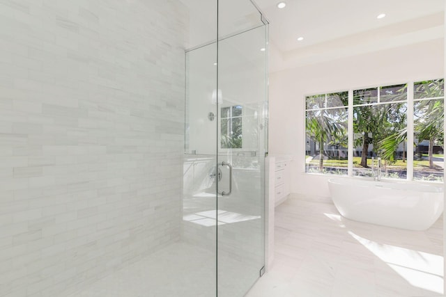 bathroom featuring separate shower and tub, tile patterned flooring, and vanity