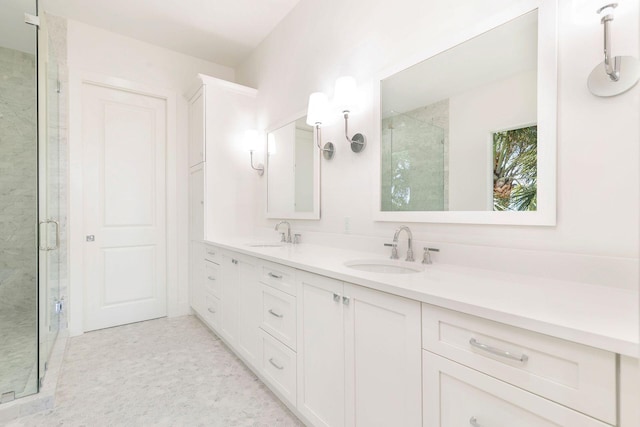 bathroom with vanity and a shower with door