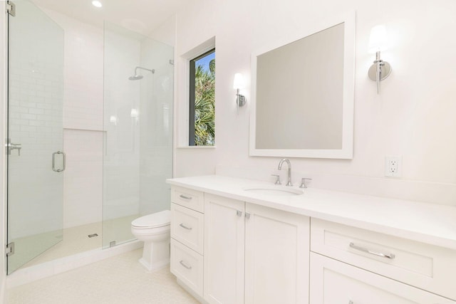 bathroom featuring an enclosed shower, vanity, toilet, and tile patterned floors