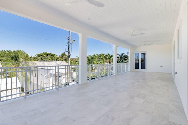 view of patio featuring french doors and ceiling fan