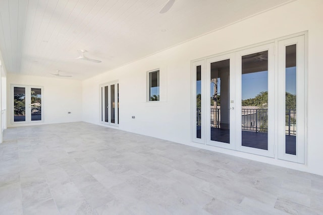 view of patio featuring ceiling fan and french doors