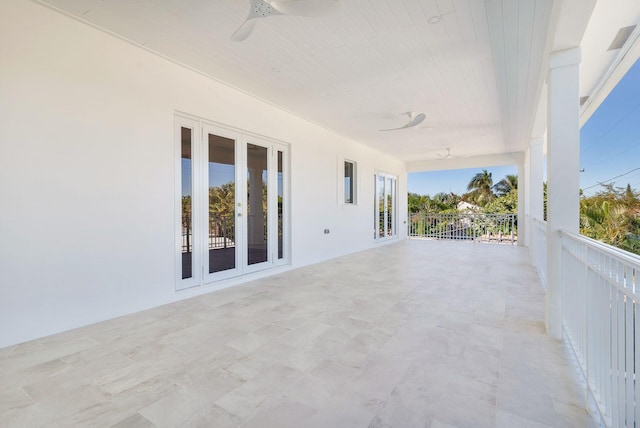 view of patio with ceiling fan and french doors