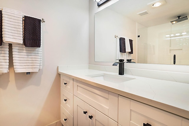 bathroom featuring vanity and walk in shower