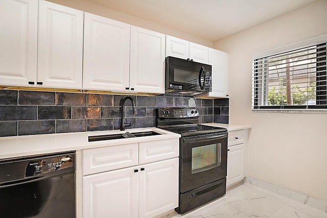 kitchen featuring tasteful backsplash, sink, white cabinets, and black appliances