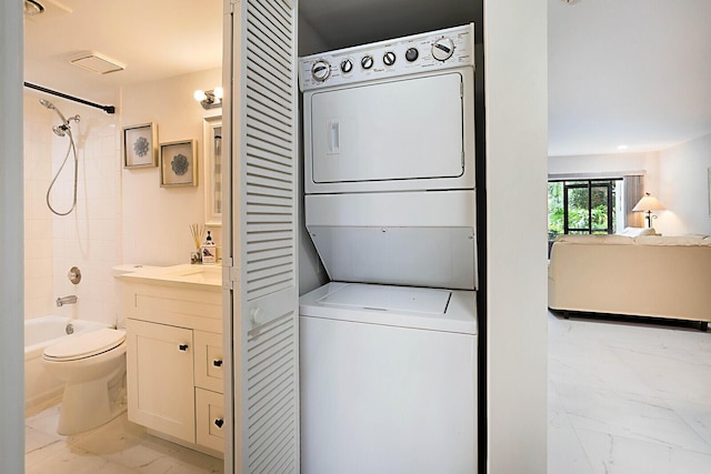 laundry room featuring stacked washing maching and dryer