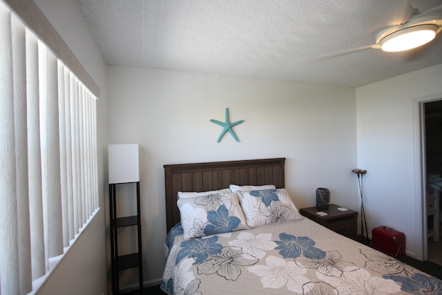 bedroom featuring a textured ceiling and ceiling fan