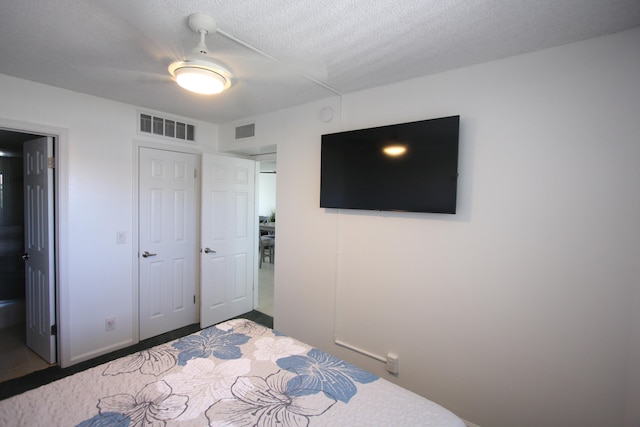 bedroom featuring a textured ceiling