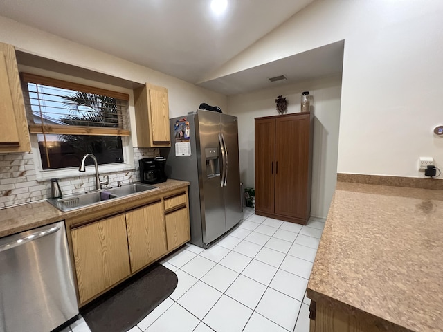 4634 Pine Grove Dr, Delray Beach, FL 33445 - kitchen featuring tasteful backsplash, appliances with stainless steel finishes, light tile patterned flooring, lofted ceiling, and a sink