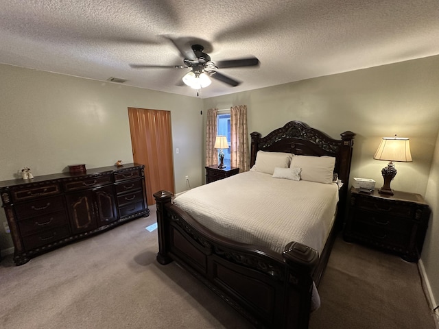 4634 Pine Grove Dr, Delray Beach, FL 33445 - bedroom with visible vents, light colored carpet, a ceiling fan, and a textured ceiling