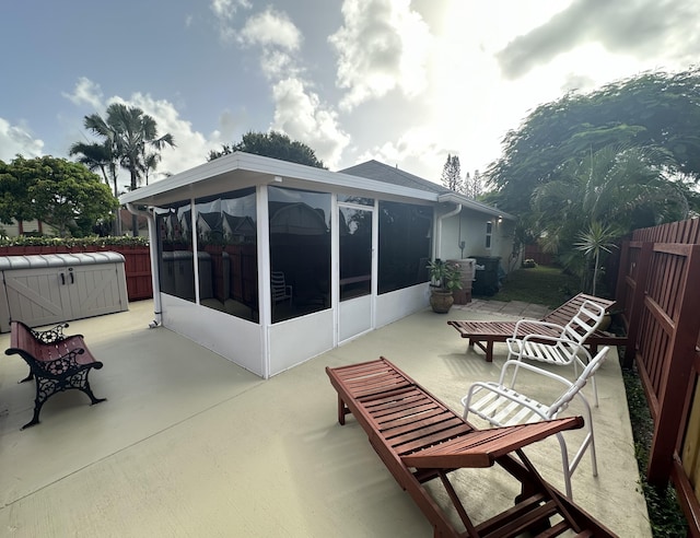 4634 Pine Grove Dr, Delray Beach, FL 33445 - view of patio featuring a fenced backyard, a sunroom, and a hot tub