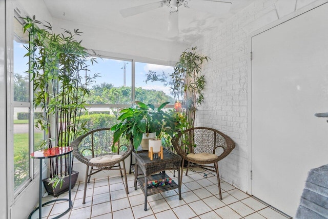 sunroom featuring ceiling fan