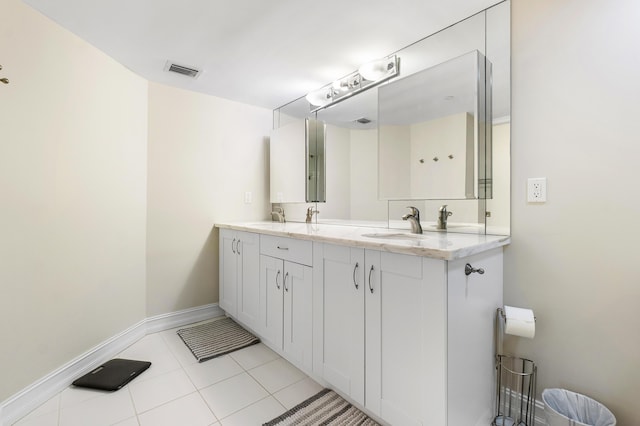 bathroom with tile patterned flooring and vanity